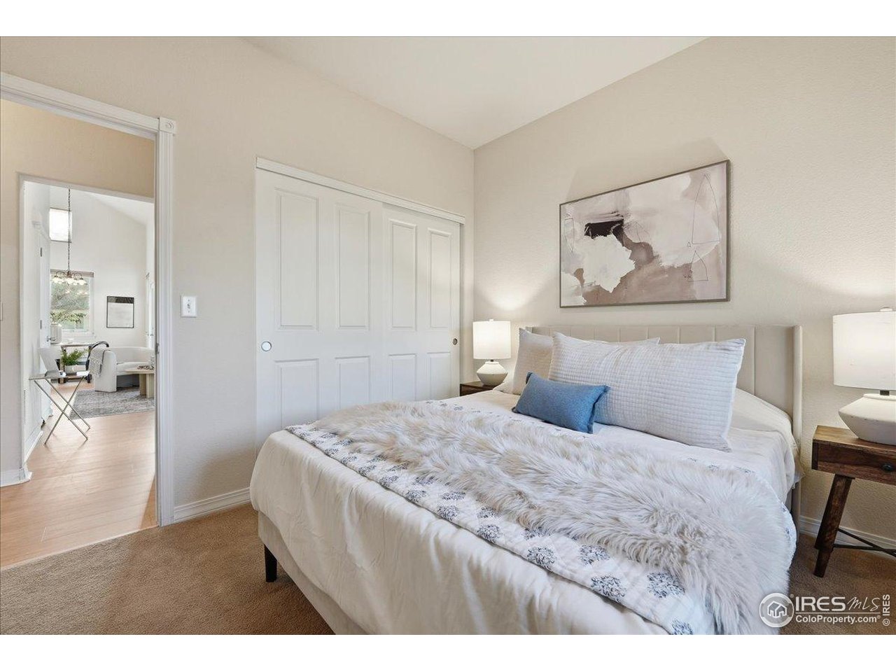 2287 Trestle Road Fort Collins, CO 80525 - Photo 27 of 40 a bedroom with a bed and a painting on the wall