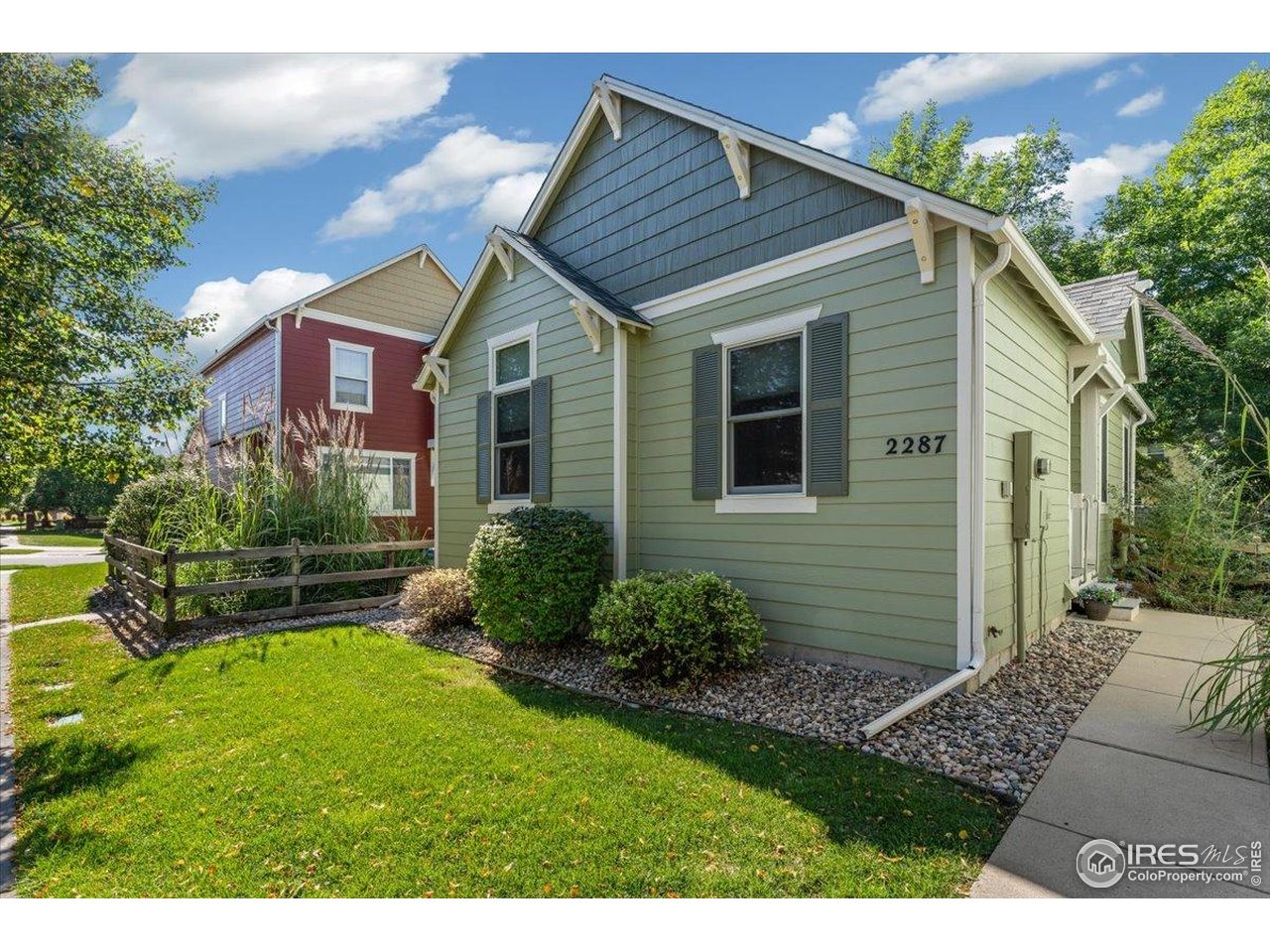 2287 Trestle Road Fort Collins, CO 80525 - Photo 5 of 40 a view of brick house with a yard potted plants