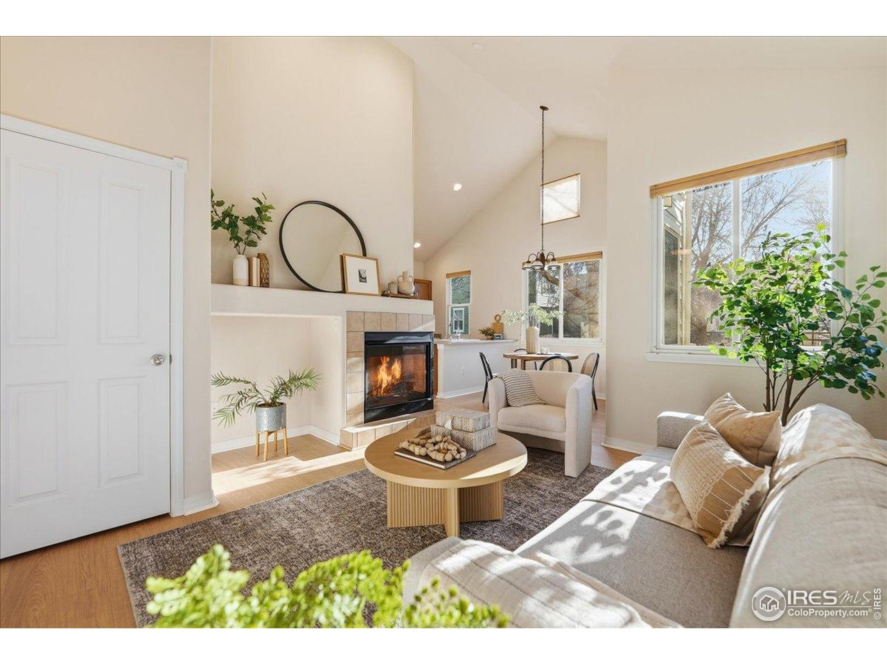 2287 Trestle Road Fort Collins, CO 80525 - Photo 7 of 40 a living room with furniture a window and a fireplace