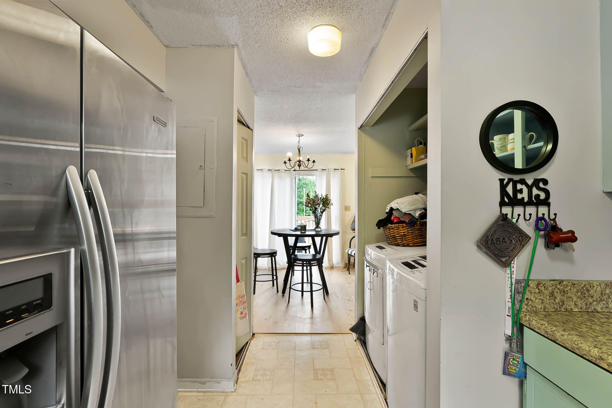 5931 Farm Gate Road Raleigh, NC 27606 - Photo 14 of 37 a kitchen with stainless steel appliances granite countertop a refrigerator a stove and a sink