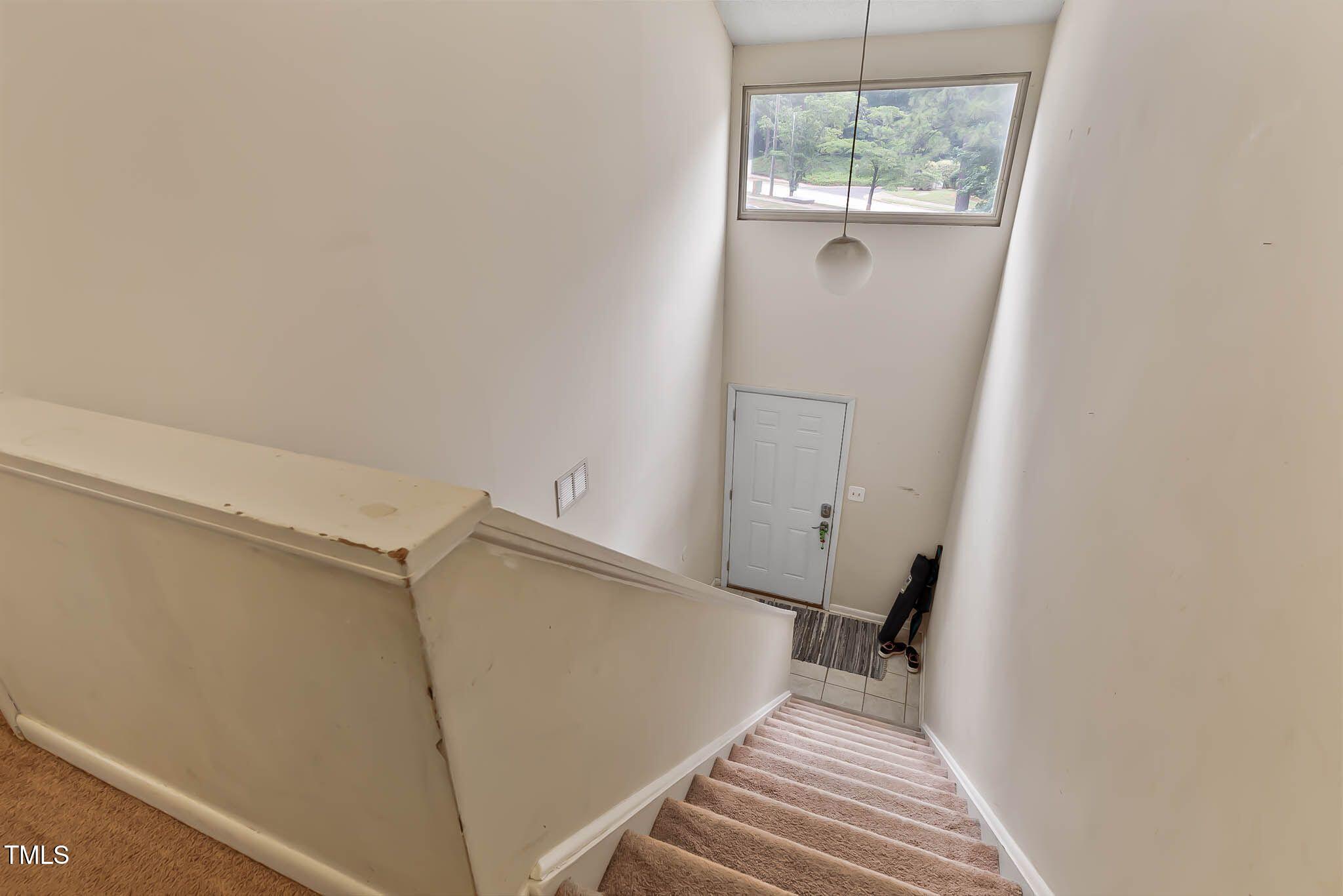 5931 Farm Gate Road Raleigh, NC 27606 - Photo 21 of 37 a view of a room with wooden floor and windows