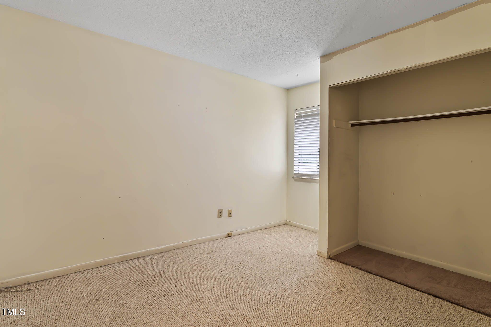 5931 Farm Gate Road Raleigh, NC 27606 - Photo 23 of 37 an empty room with closet