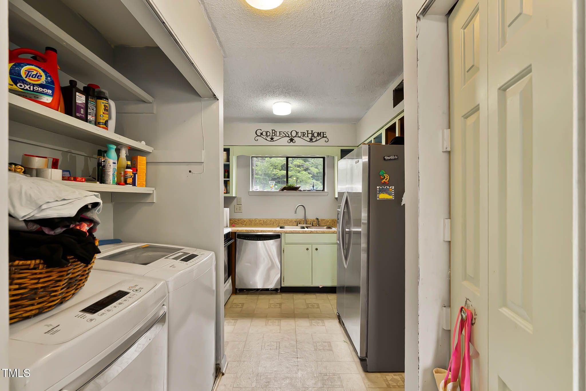 5931 Farm Gate Road Raleigh, NC 27606 - Photo 8 of 37 a kitchen with stainless steel appliances granite countertop a refrigerator and a stove