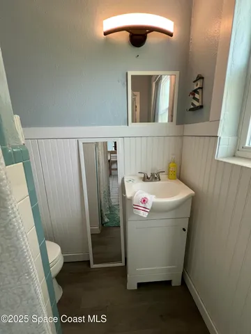 a view of a bathroom with a sink and mirror