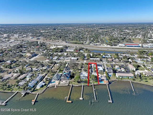 an aerial view of a chairs and table