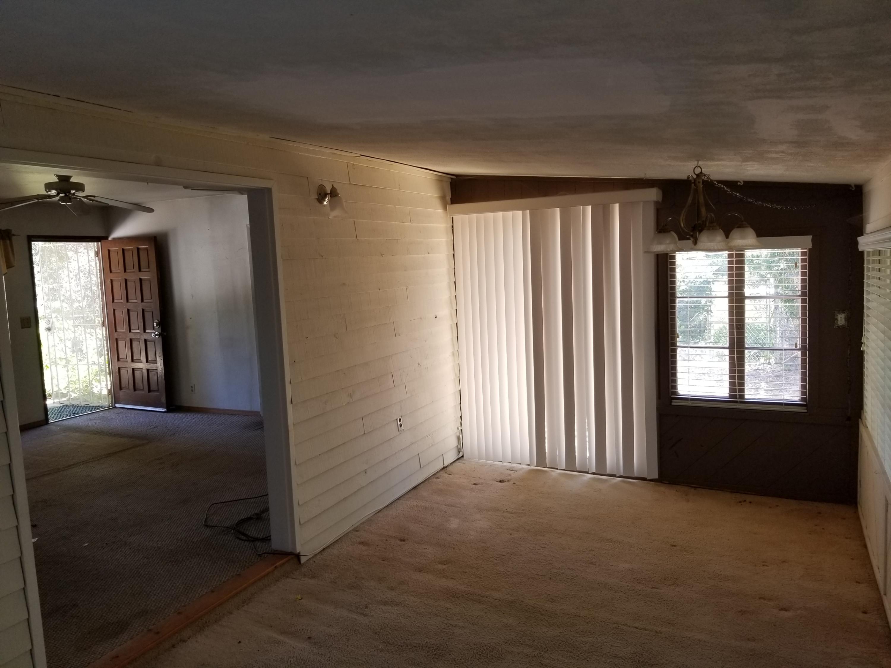 17843 Irish Road Redding, CA 96003 - Photo 8 of 13 a view of empty room with windows