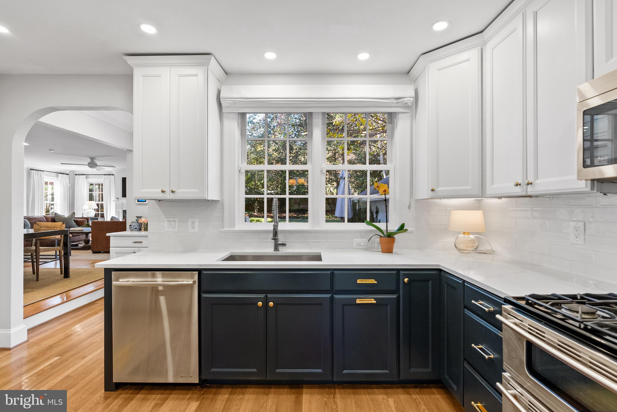 6032 Fort Hunt Road Alexandria, VA 22307 - Photo 17 of 49 a kitchen with granite countertop a sink a counter space appliances and cabinets
