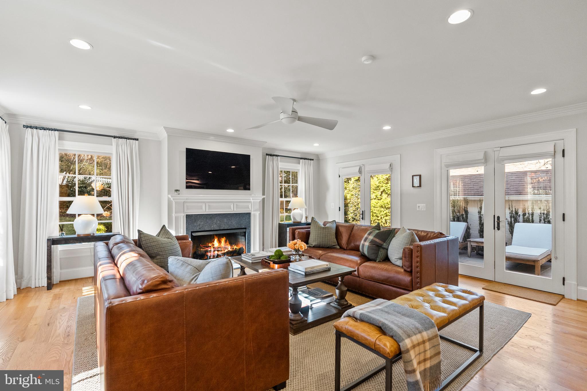 6032 Fort Hunt Road Alexandria, VA 22307 - Photo 22 of 49 a living room with furniture fireplace and a flat screen tv