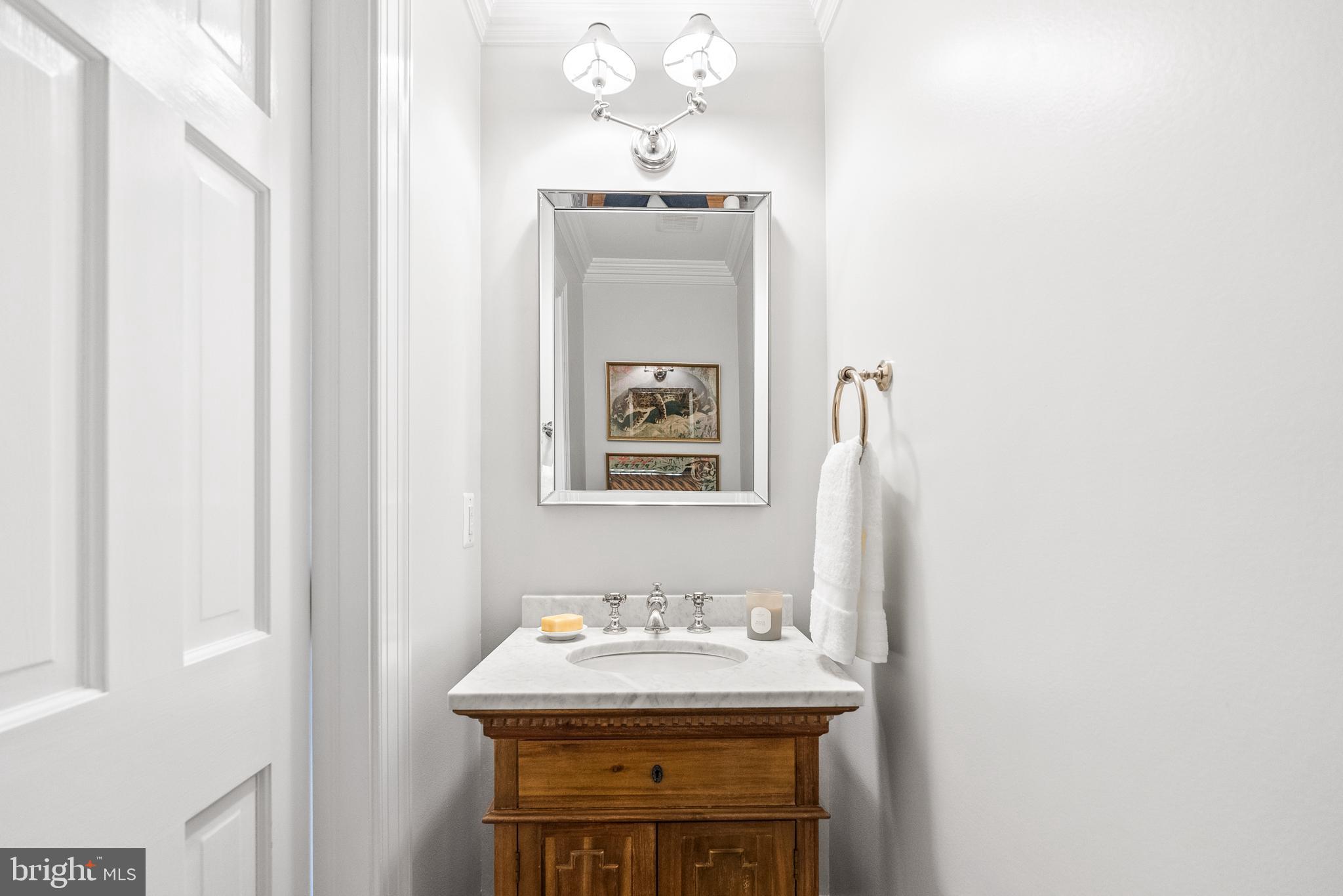 6032 Fort Hunt Road Alexandria, VA 22307 - Photo 24 of 49 a bathroom with a sink and a mirror