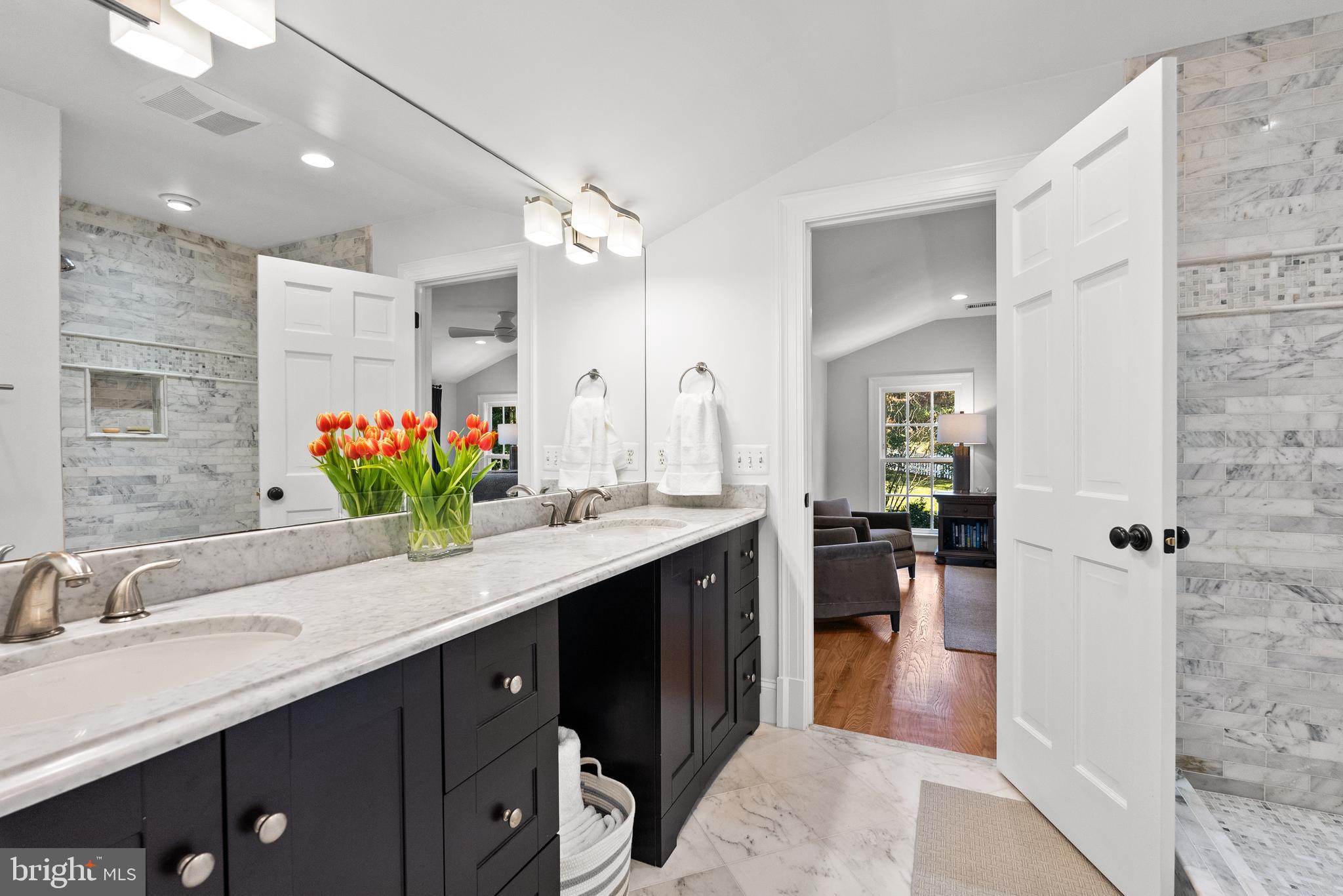 6032 Fort Hunt Road Alexandria, VA 22307 - Photo 29 of 49 a spacious bathroom with a granite countertop sink mirror and shower