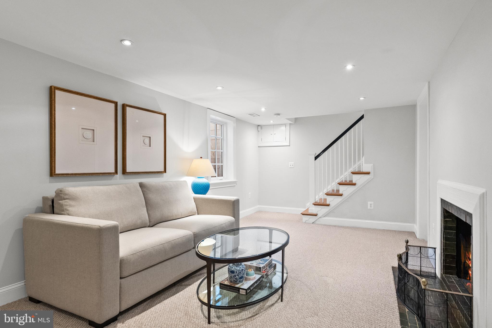 6032 Fort Hunt Road Alexandria, VA 22307 - Photo 36 of 49 a living room with furniture and a fireplace