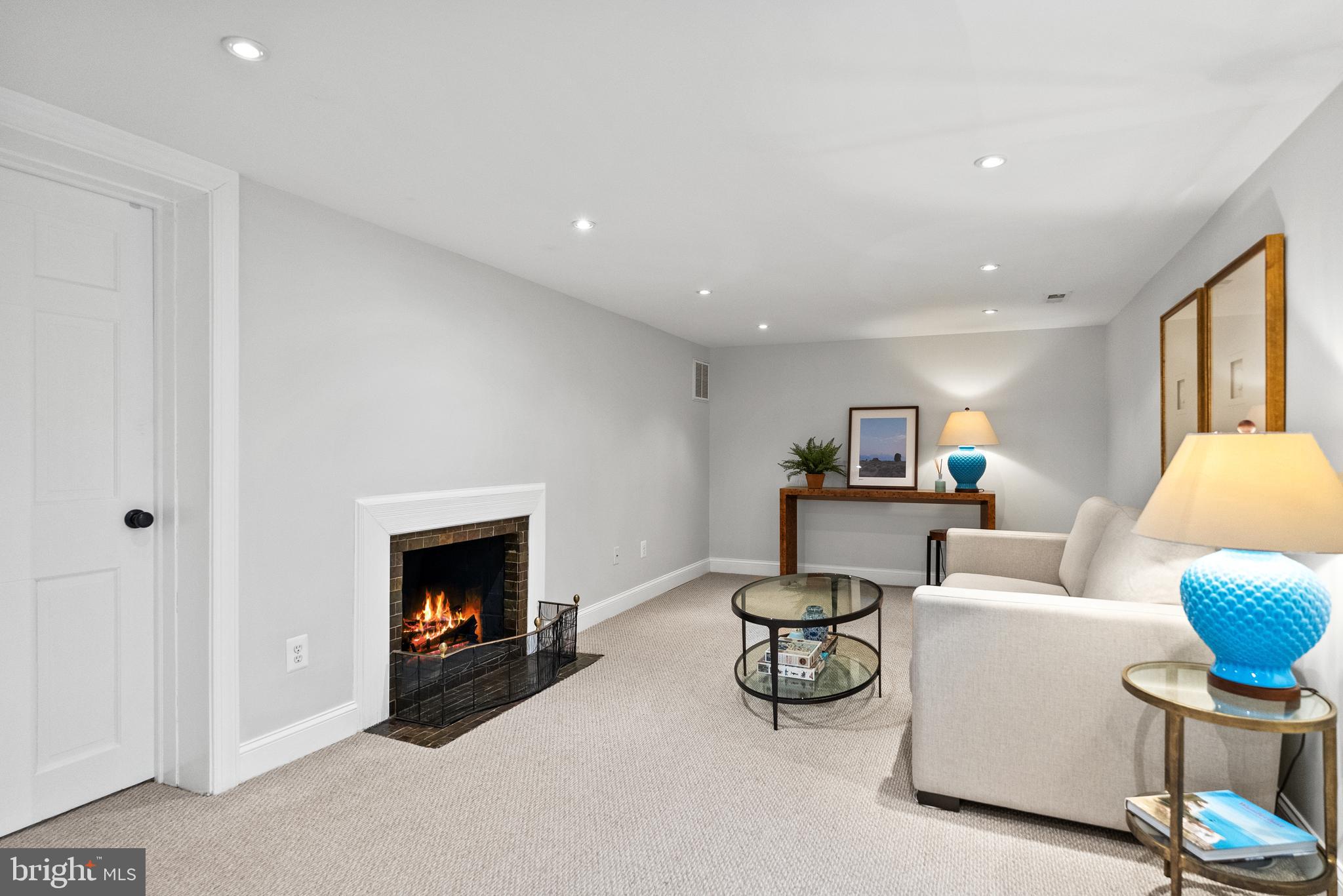 6032 Fort Hunt Road Alexandria, VA 22307 - Photo 37 of 49 a living room with furniture and a fireplace