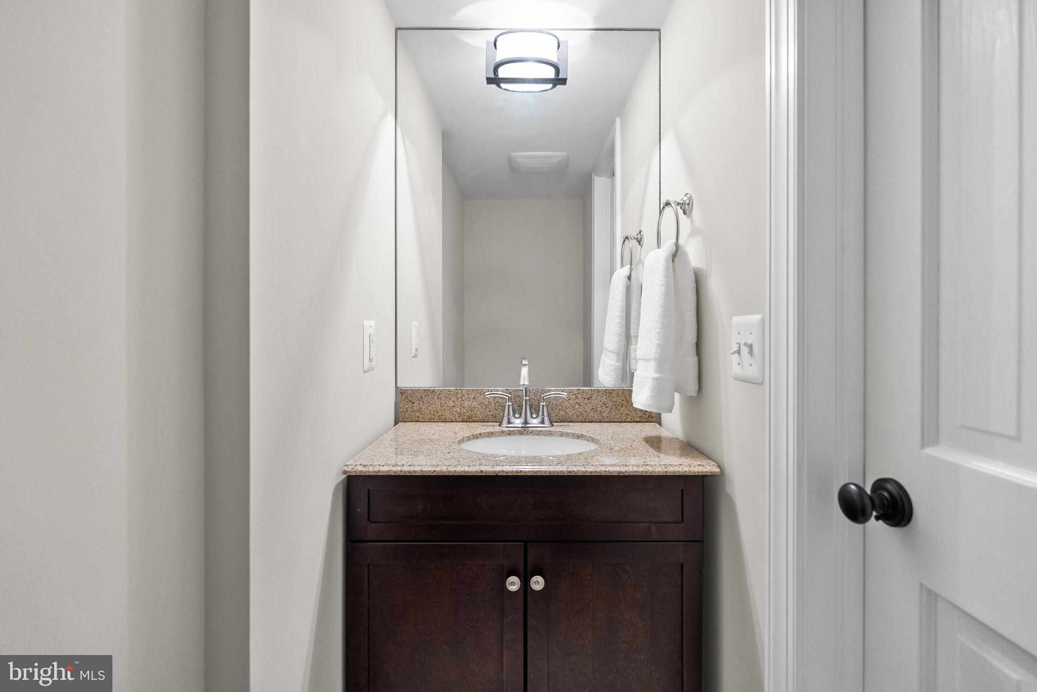 6032 Fort Hunt Road Alexandria, VA 22307 - Photo 38 of 49 a sink and a mirror