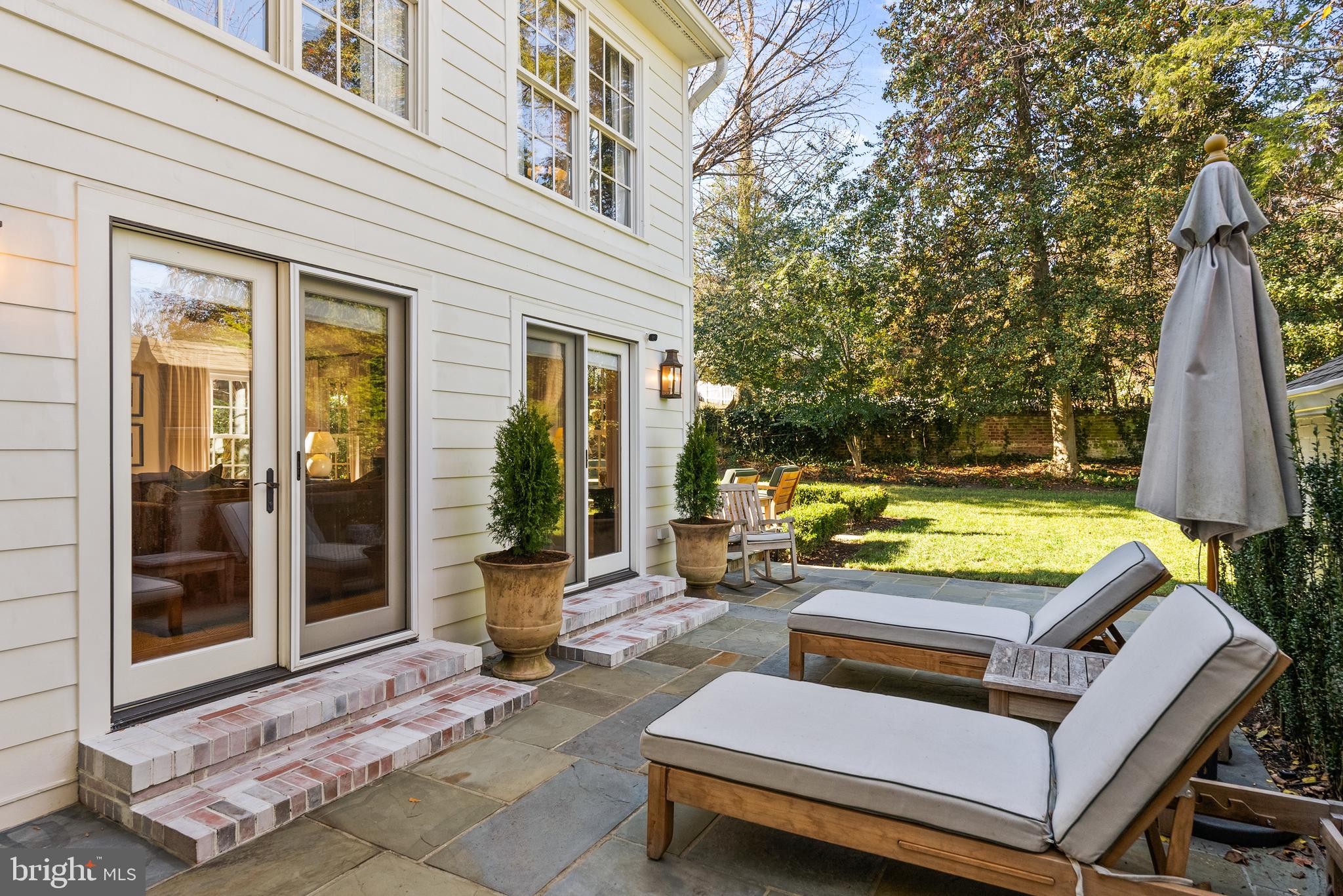 6032 Fort Hunt Road Alexandria, VA 22307 - Photo 40 of 49 a view of a patio with couches table and chairs with wooden floor and fence