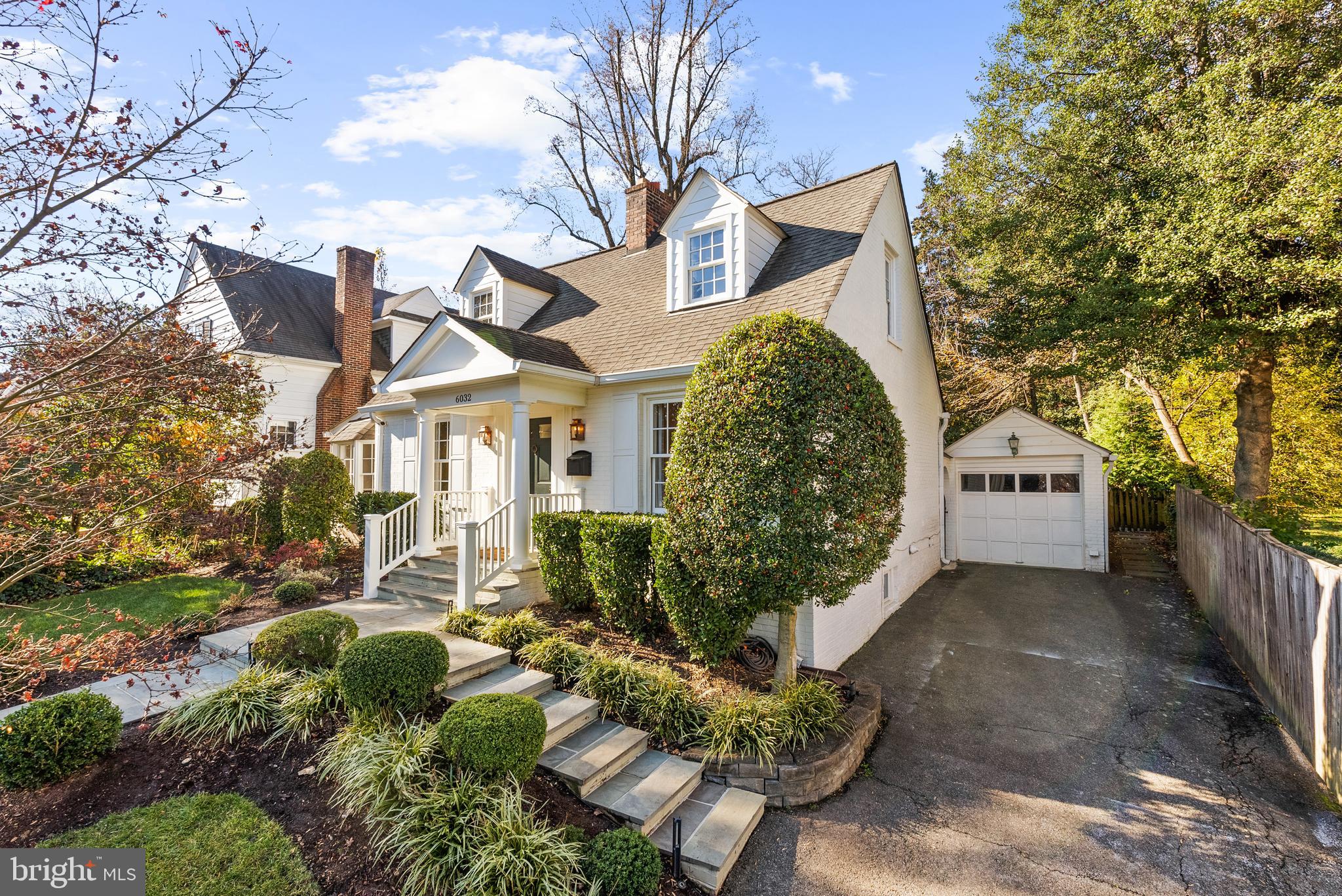 6032 Fort Hunt Road Alexandria, VA 22307 - Photo 8 of 49 a front view of a house with a yard and outdoor seating