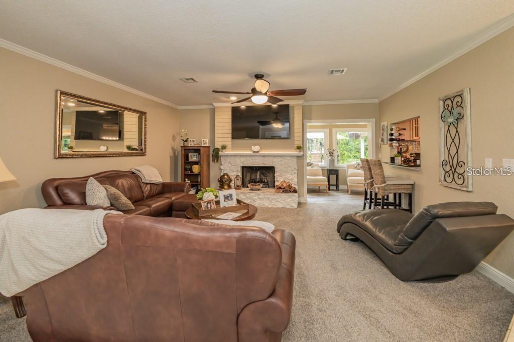 3341 Southeast 45th Street Ocala, FL 34480 - Photo 11 of 50 a living room with furniture fireplace and flat screen tv