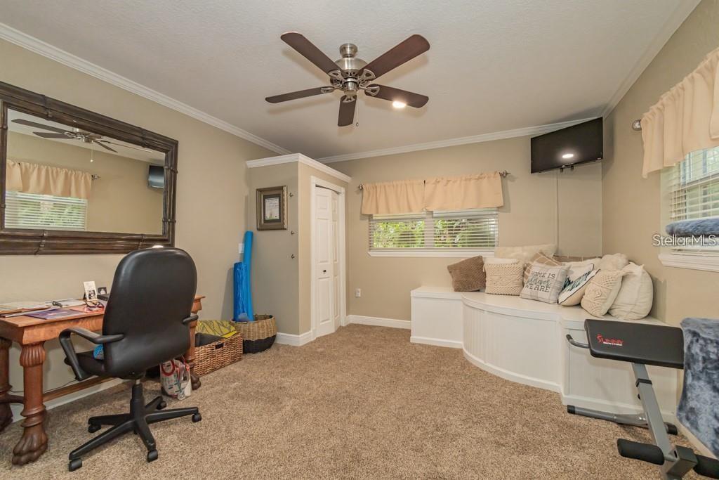 3341 Southeast 45th Street Ocala, FL 34480 - Photo 25 of 50 a work room with furniture and windows