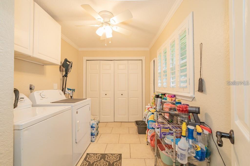 3341 Southeast 45th Street Ocala, FL 34480 - Photo 26 of 50 a room with storage and utility