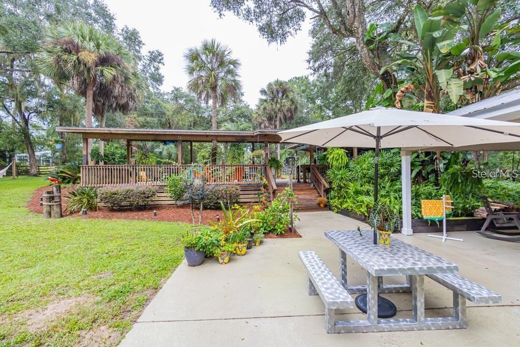 3341 Southeast 45th Street Ocala, FL 34480 - Photo 27 of 50 a view of a chair and table on the garden