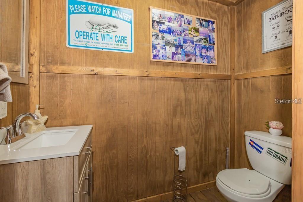 3341 Southeast 45th Street Ocala, FL 34480 - Photo 34 of 50 a bathroom with a toilet a sink and a shower curtain