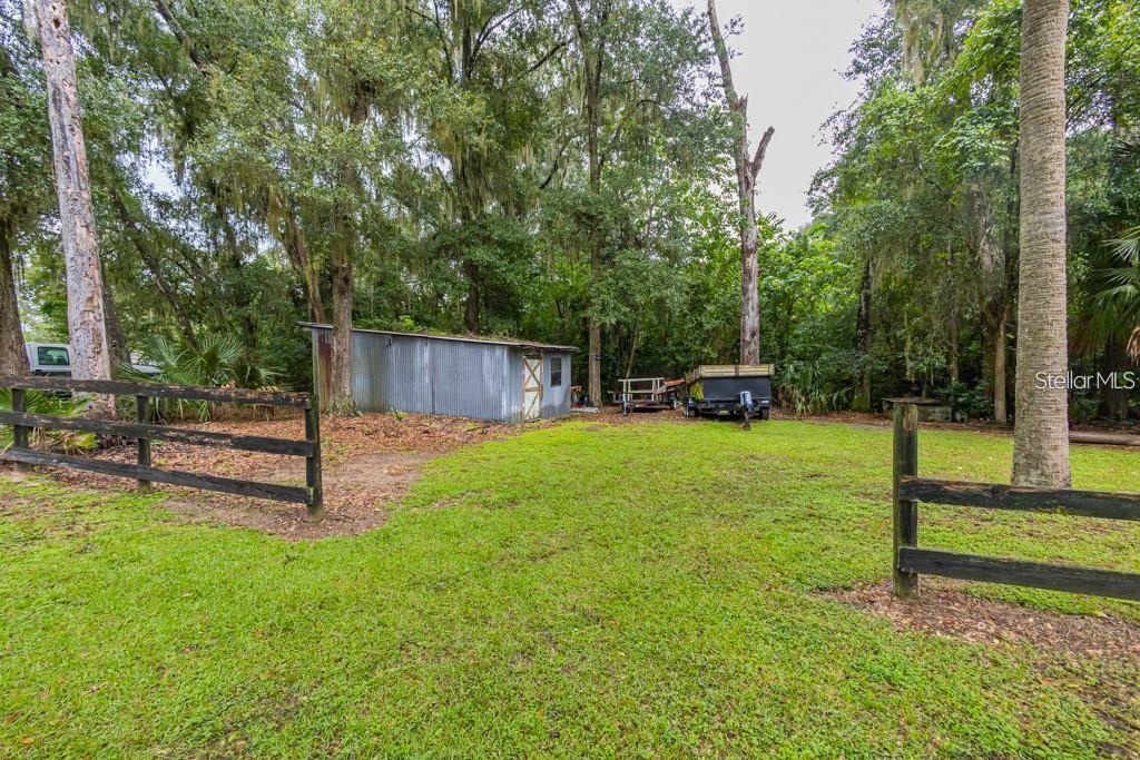 3341 Southeast 45th Street Ocala, FL 34480 - Photo 43 of 50 a house view with a sitting space and garden