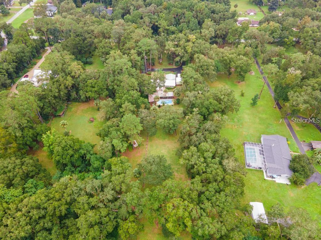 3341 Southeast 45th Street Ocala, FL 34480 - Photo 46 of 50 an aerial view of residential house with outdoor space and trees all around