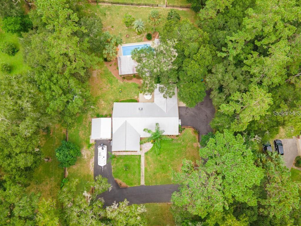 3341 Southeast 45th Street Ocala, FL 34480 - Photo 48 of 50 an aerial view of a house with a yard