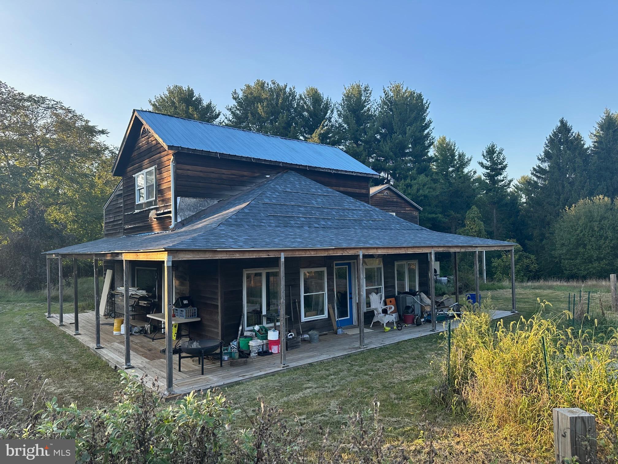 411 Marshall Road Glenmoore, PA 19343 - Photo 1 of 49 a view of a house with backyard porch and sitting area