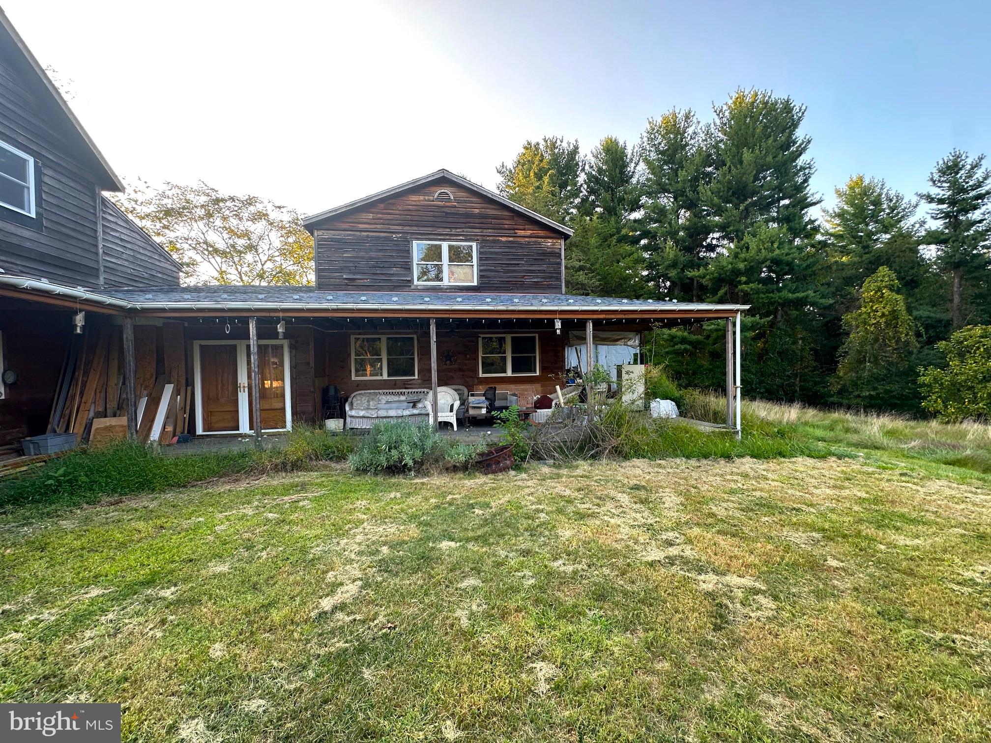 411 Marshall Road Glenmoore, PA 19343 - Photo 6 of 49 a view of a house with a yard and sitting area