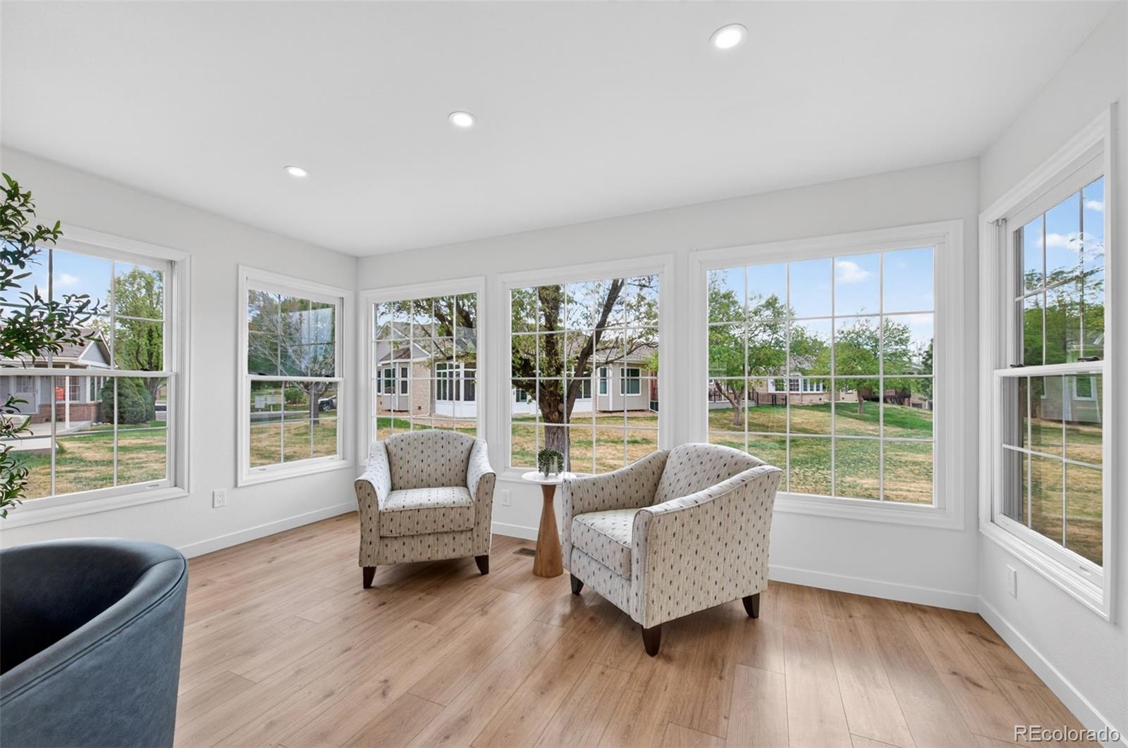 8943 Greenspointe Lane Highlands Ranch, CO 80130 - Photo 12 of 38 a living room with furniture and a large window