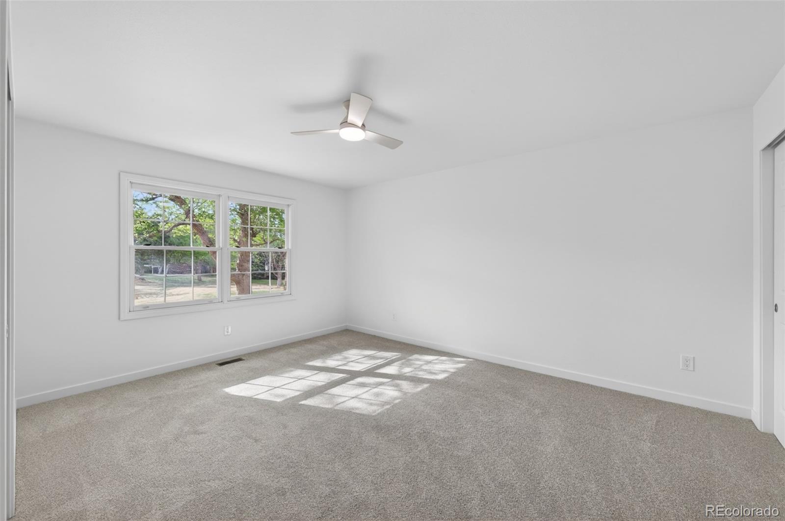 8943 Greenspointe Lane Highlands Ranch, CO 80130 - Photo 19 of 38 an empty room with a window