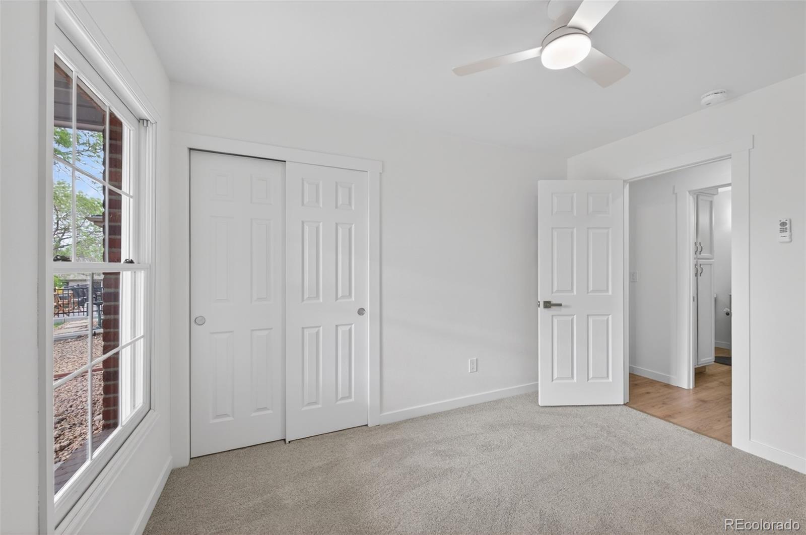8943 Greenspointe Lane Highlands Ranch, CO 80130 - Photo 22 of 38 an empty room with windows