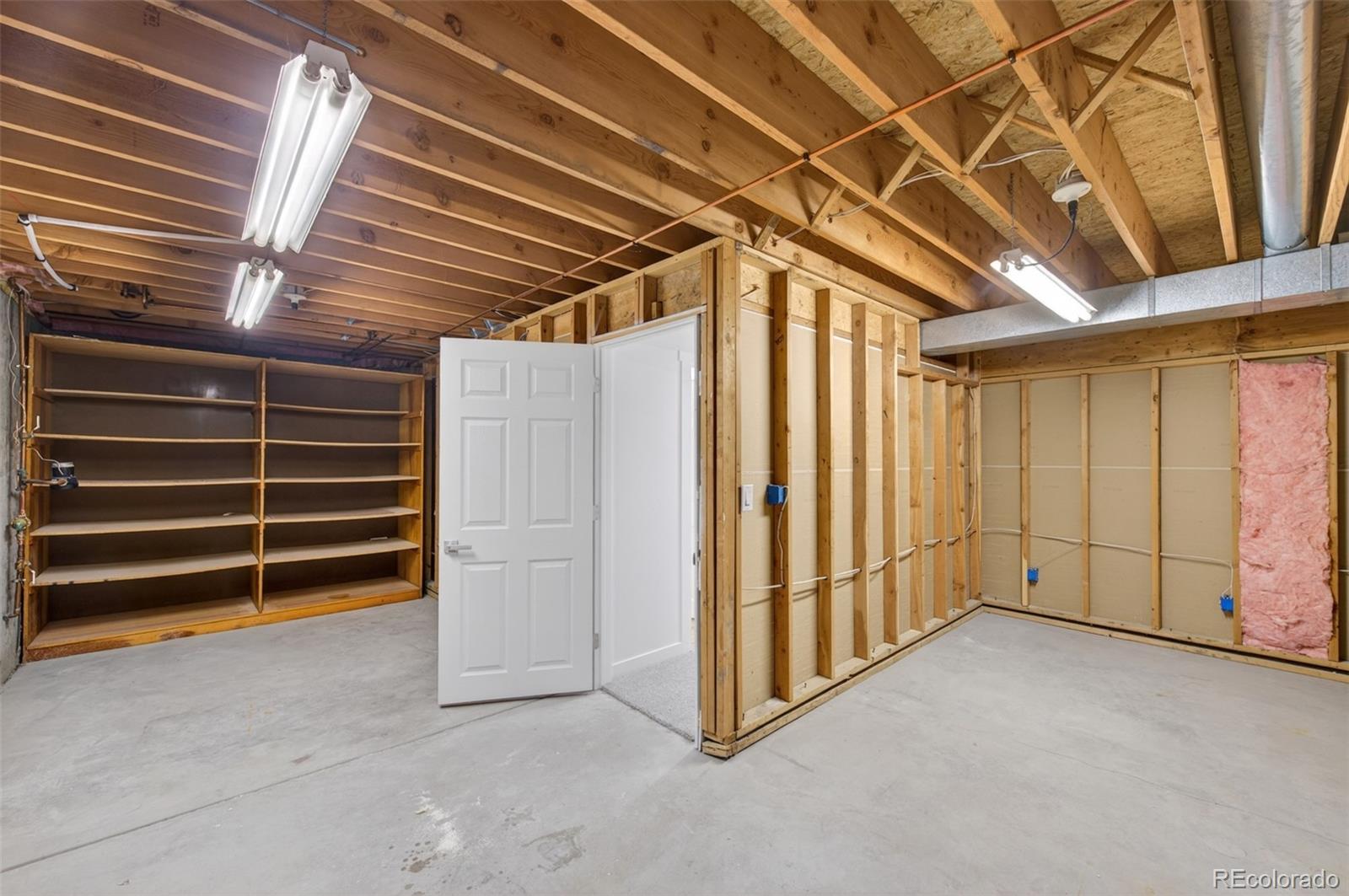 8943 Greenspointe Lane Highlands Ranch, CO 80130 - Photo 27 of 38 a view of an empty room with a staircase
