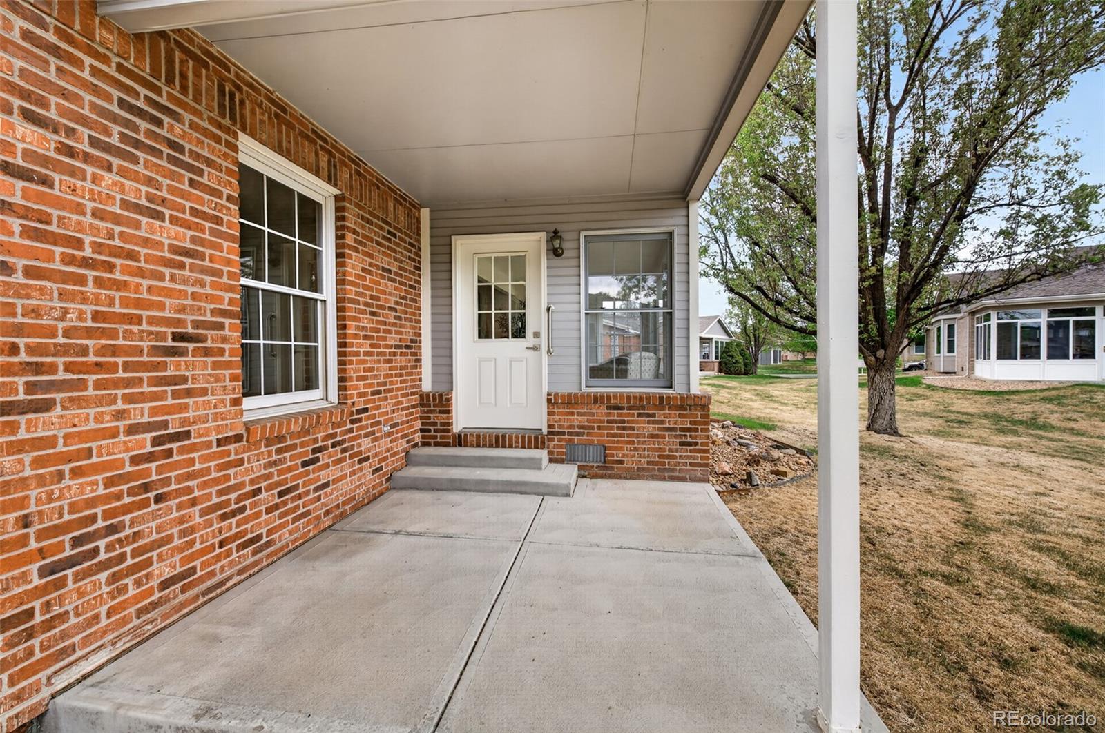 8943 Greenspointe Lane Highlands Ranch, CO 80130 - Photo 33 of 38 a view of a house with a backyard