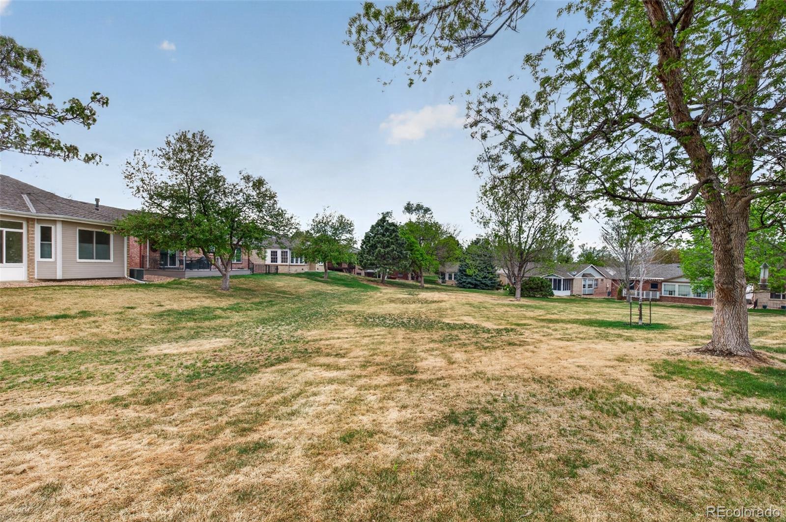 8943 Greenspointe Lane Highlands Ranch, CO 80130 - Photo 35 of 38 a view of a house with a yard
