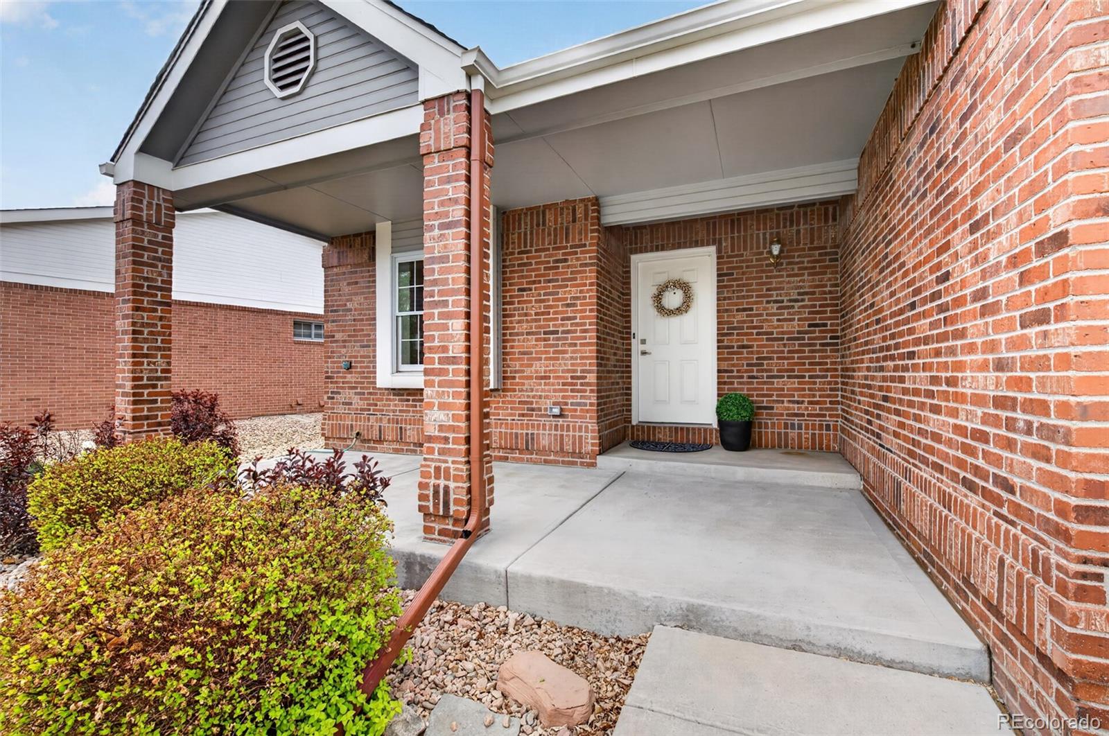 8943 Greenspointe Lane Highlands Ranch, CO 80130 - Photo 37 of 38 a view of the front door of a house