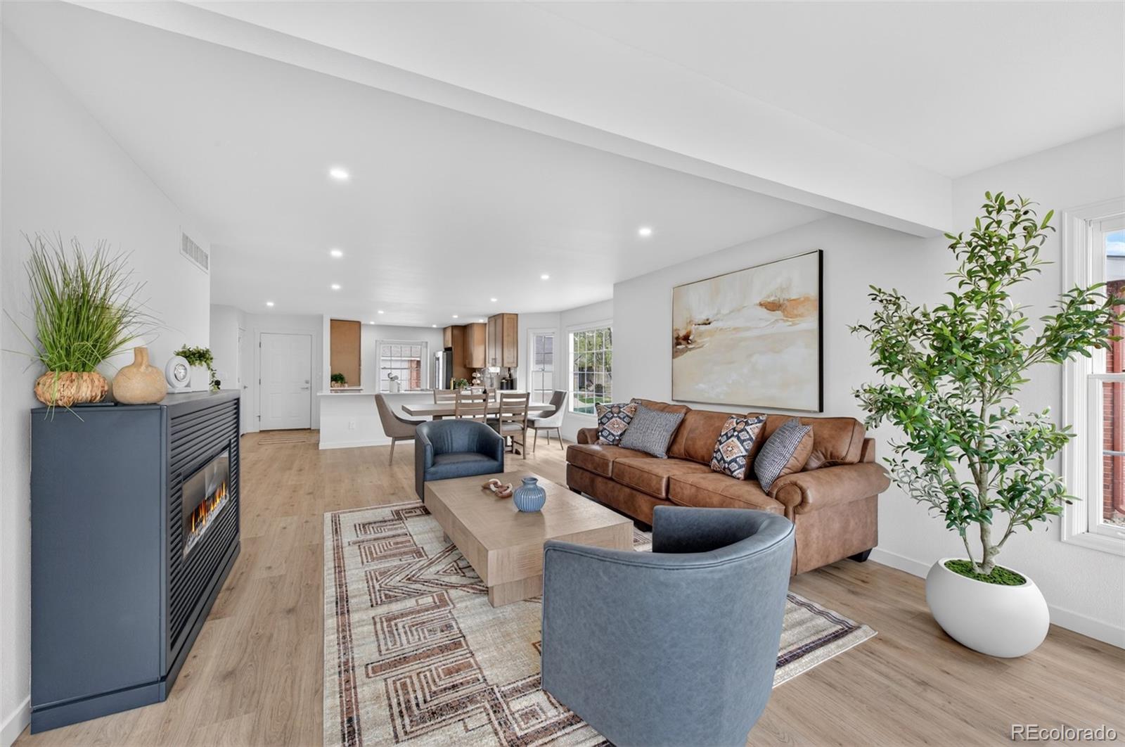 8943 Greenspointe Lane Highlands Ranch, CO 80130 - Photo 8 of 38 a living room with furniture potted plant and a window