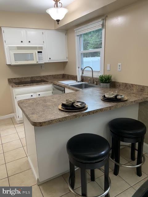 30 East Stokes Road Willingboro, NJ 08046 - Photo 12 of 26 a kitchen with a sink cabinets and window