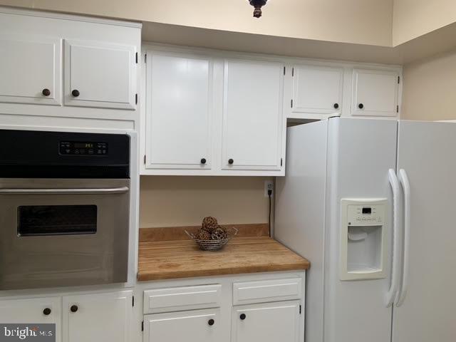30 East Stokes Road Willingboro, NJ 08046 - Photo 14 of 26 a kitchen with white cabinets and white appliances