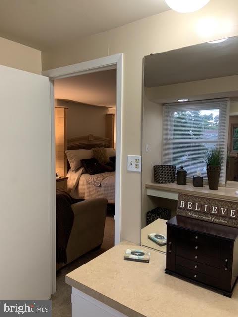 30 East Stokes Road Willingboro, NJ 08046 - Photo 15 of 26 a living room with a bed and a dresser