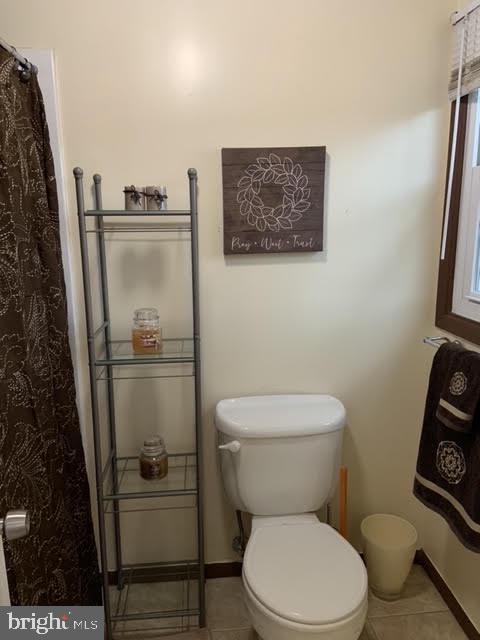 30 East Stokes Road Willingboro, NJ 08046 - Photo 21 of 26 a white toilet sitting next to a small bathroom