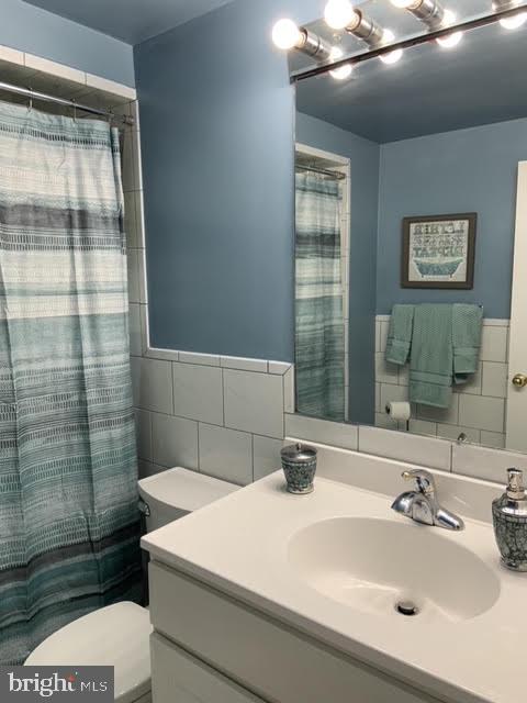 30 East Stokes Road Willingboro, NJ 08046 - Photo 22 of 26 a bathroom with a sink a toilet and shower