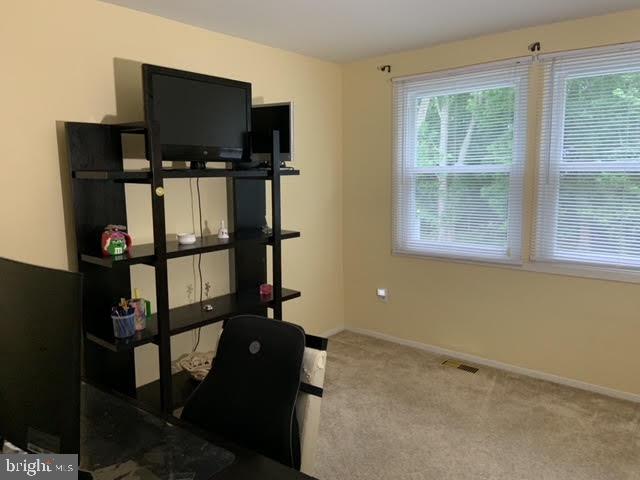 30 East Stokes Road Willingboro, NJ 08046 - Photo 25 of 26 a living room with flat screen tv and a window