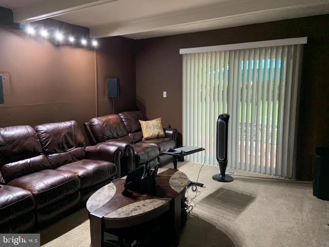 30 East Stokes Road Willingboro, NJ 08046 - Photo 8 of 26 a living room with furniture and a large window