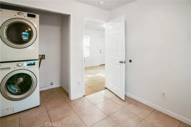 a view of a storage and utility room with washer and dryer