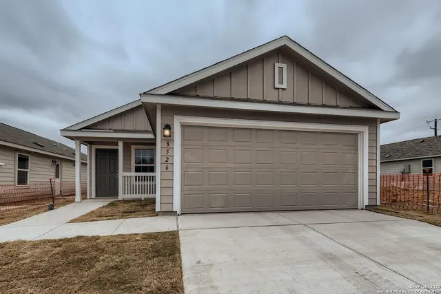 a front view of a house with a garage