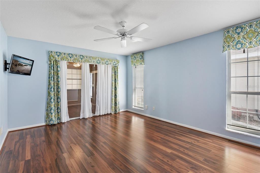 11614 Southeast 172nd Loop Summerfield, FL 34491 - Photo 17 of 55 a view of an empty room with a window and wooden floor