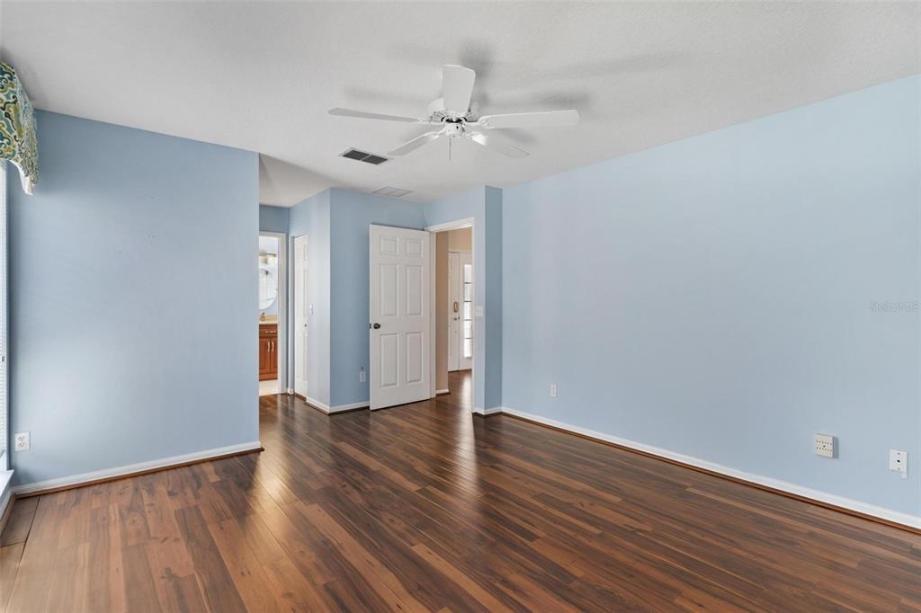 11614 Southeast 172nd Loop Summerfield, FL 34491 - Photo 18 of 55 a view of an empty room with wooden floor