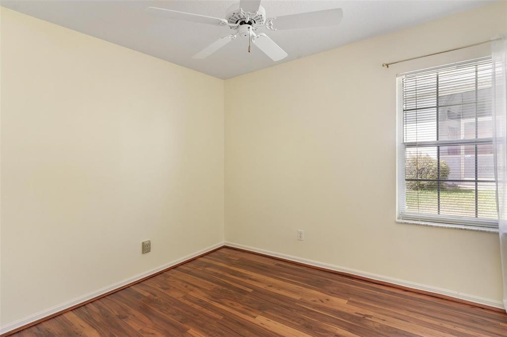 11614 Southeast 172nd Loop Summerfield, FL 34491 - Photo 23 of 55 an empty room with wooden floor fan and windows