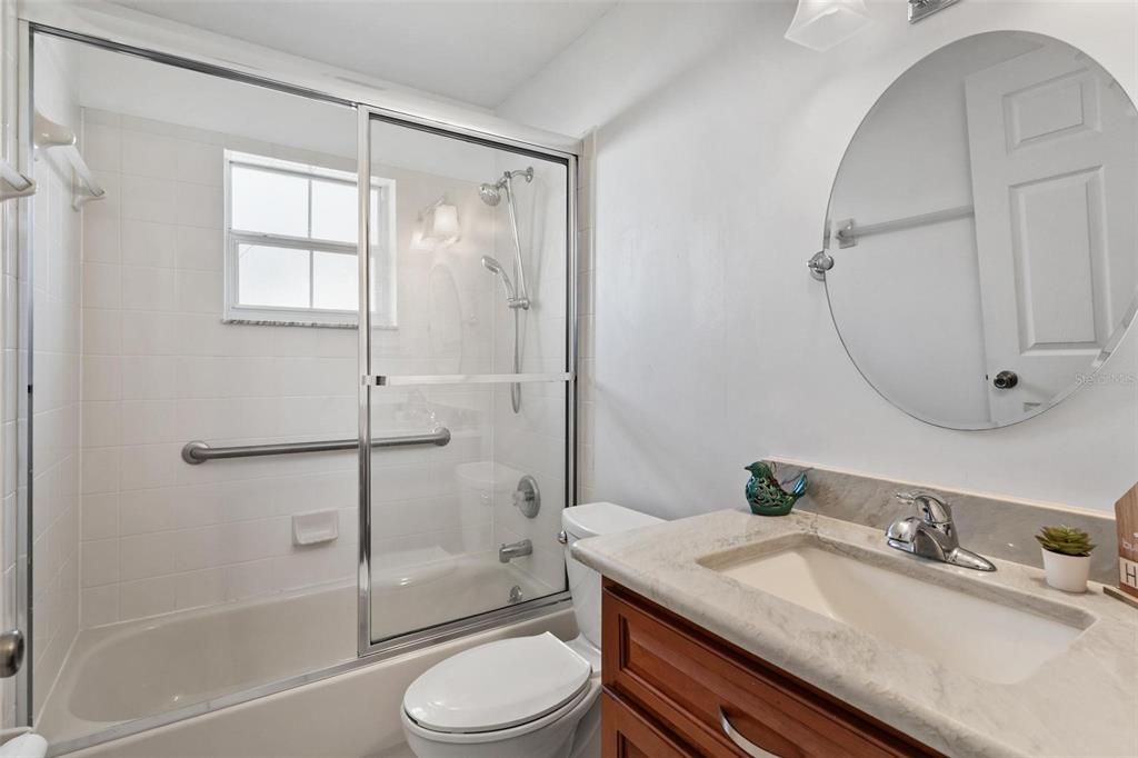 11614 Southeast 172nd Loop Summerfield, FL 34491 - Photo 24 of 55 a bathroom with a granite countertop sink toilet and shower